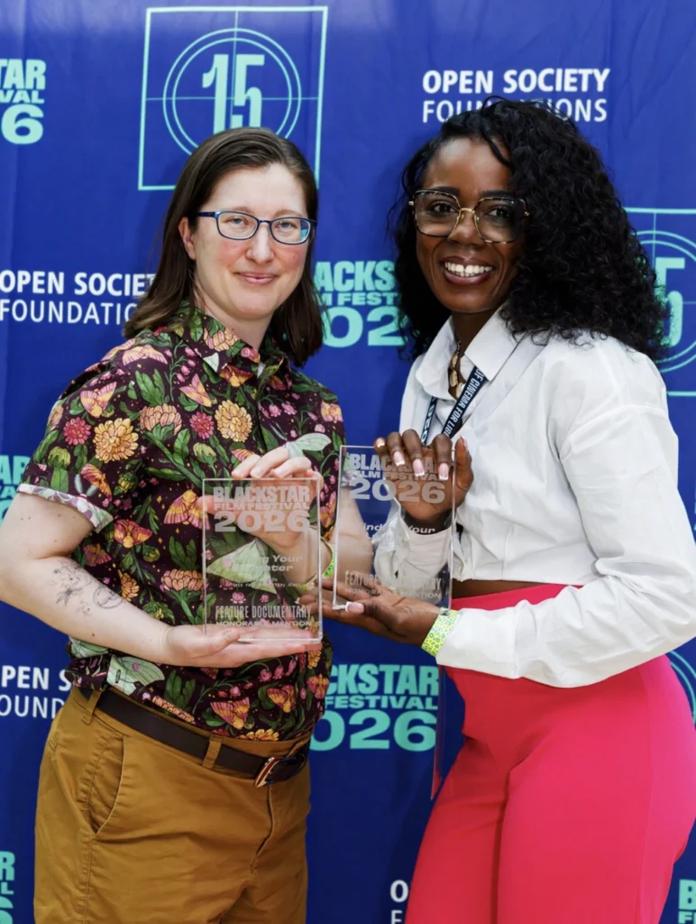 Arelita holding the Caregiver Basket award at the BlackStar Film Festival